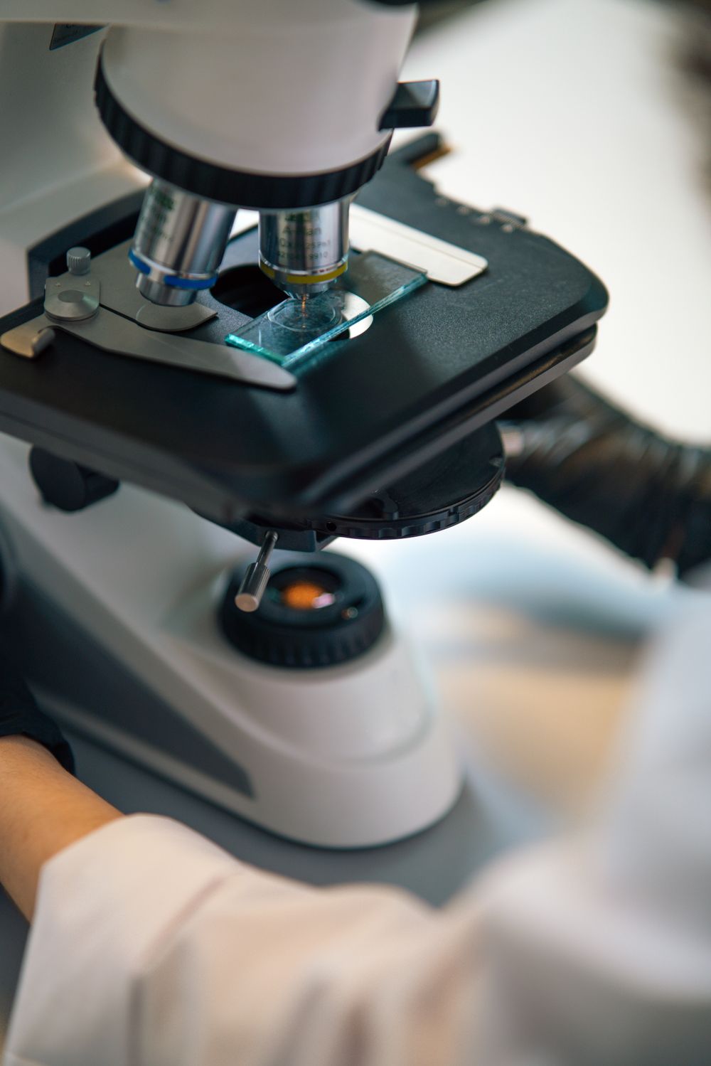 Close view of a microscope stage with a sample slide